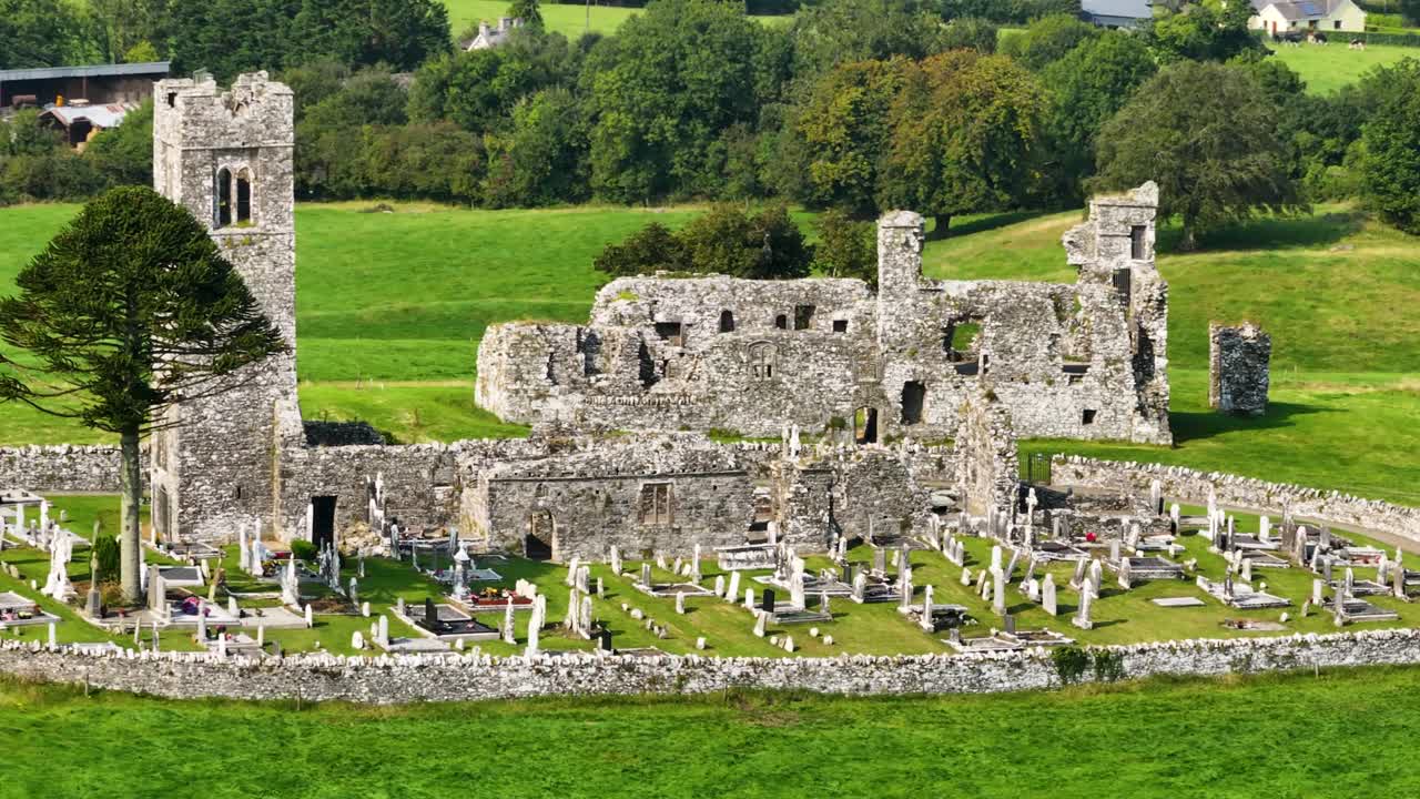 Slane Abbey, aerial drone view of old church with graveyard and monastery ruins. Ireland