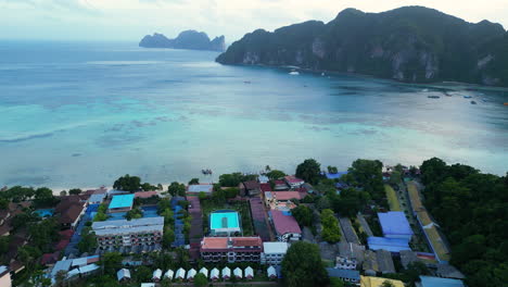 Vacation-homes-on-the-coast-of-island-Koh-Phi-Phi,-Thailand,-aerial-blue-hour