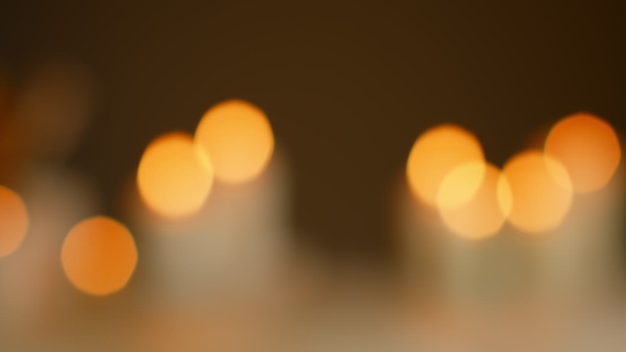 Close Up Defocused Still Life Shot Of Lit Candles At Relaxing Spa Day Decor