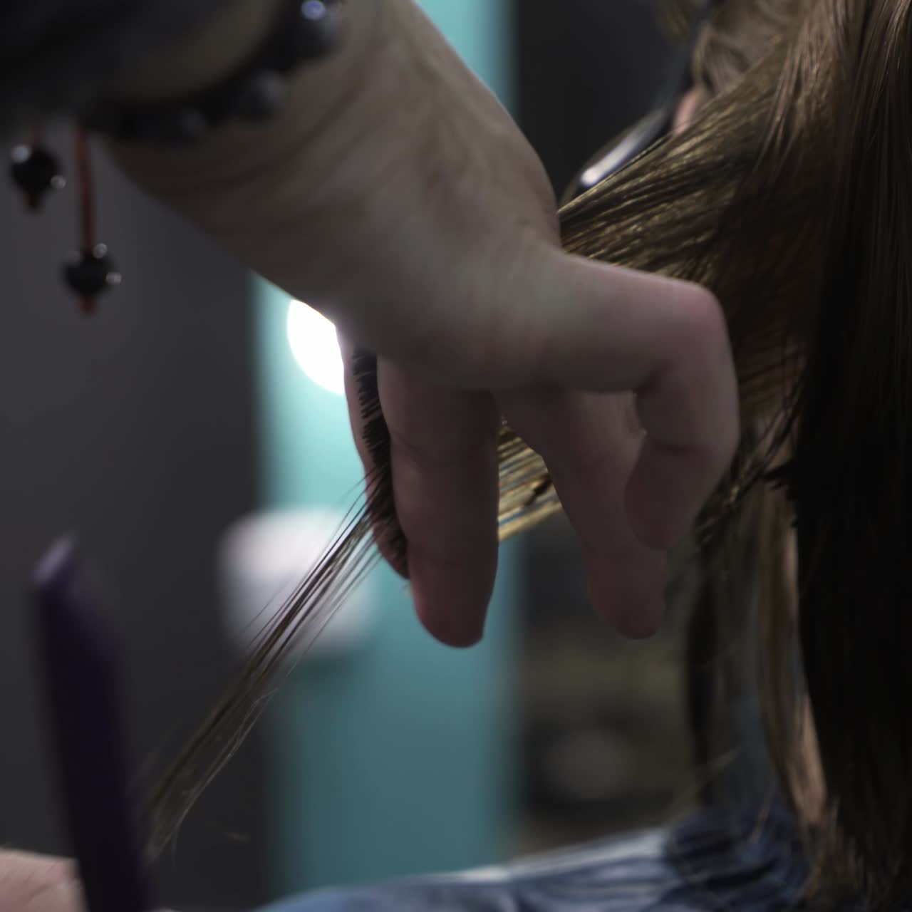 Professional stylist working with client