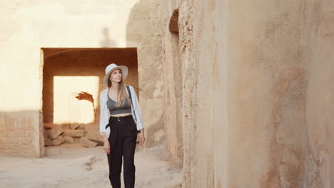 woman exploring ancient ruins