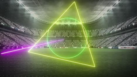 animation of rotating neon shapes and lights over floodlit sports stadium