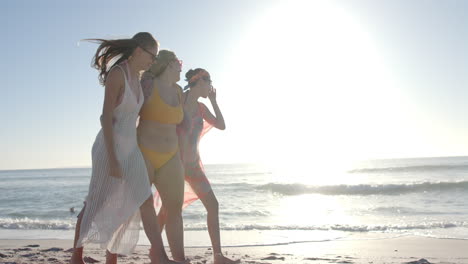 Three-young-women-enjoy-a-sunny-beach-day