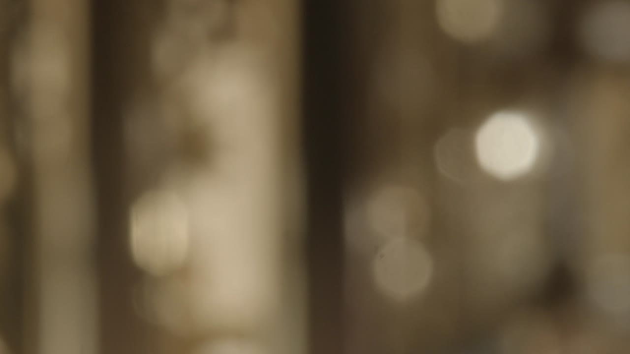 Slower shifting abstract golden bokeh background.