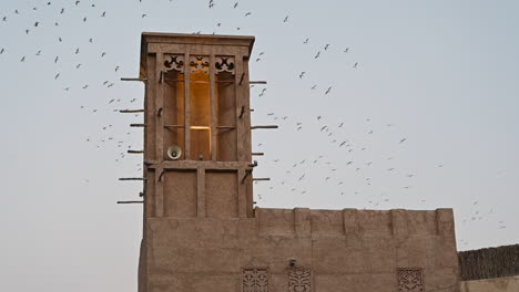 Traditional-Wind-Tower-On-an-old-house-in-the-Historical-Neighborhood-Of-Al-Fahidi,-Dubai,-United-Arab-Emirates