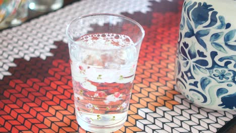 pouring water into a glass