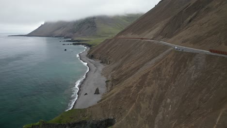 Coastal-road-crossing-the-mountain-edge-next-to-the-ocean