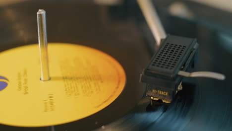 close up of a vintage lp vinyl record spinning on a turntable