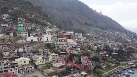 small town with a church in the middle of a lake in guatemala.