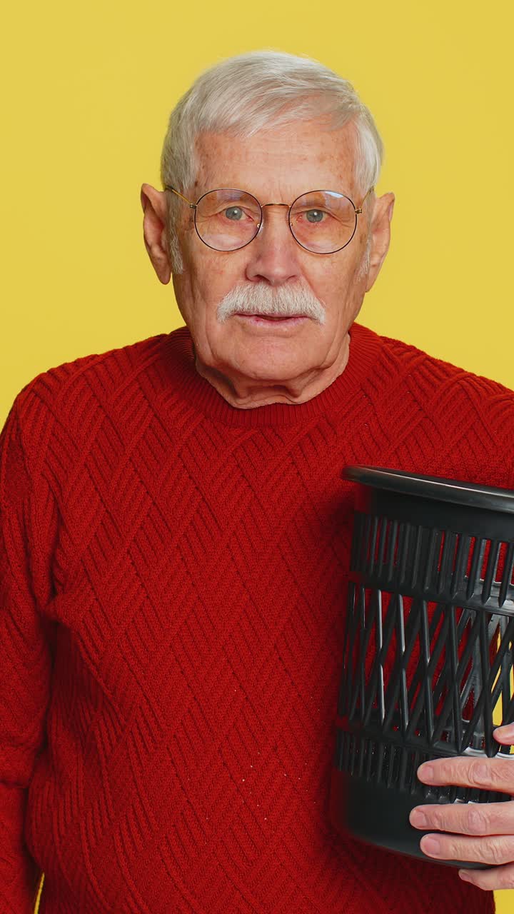 Man taking off throwing out glasses into bin after medical vision laser treatment therapy surgery