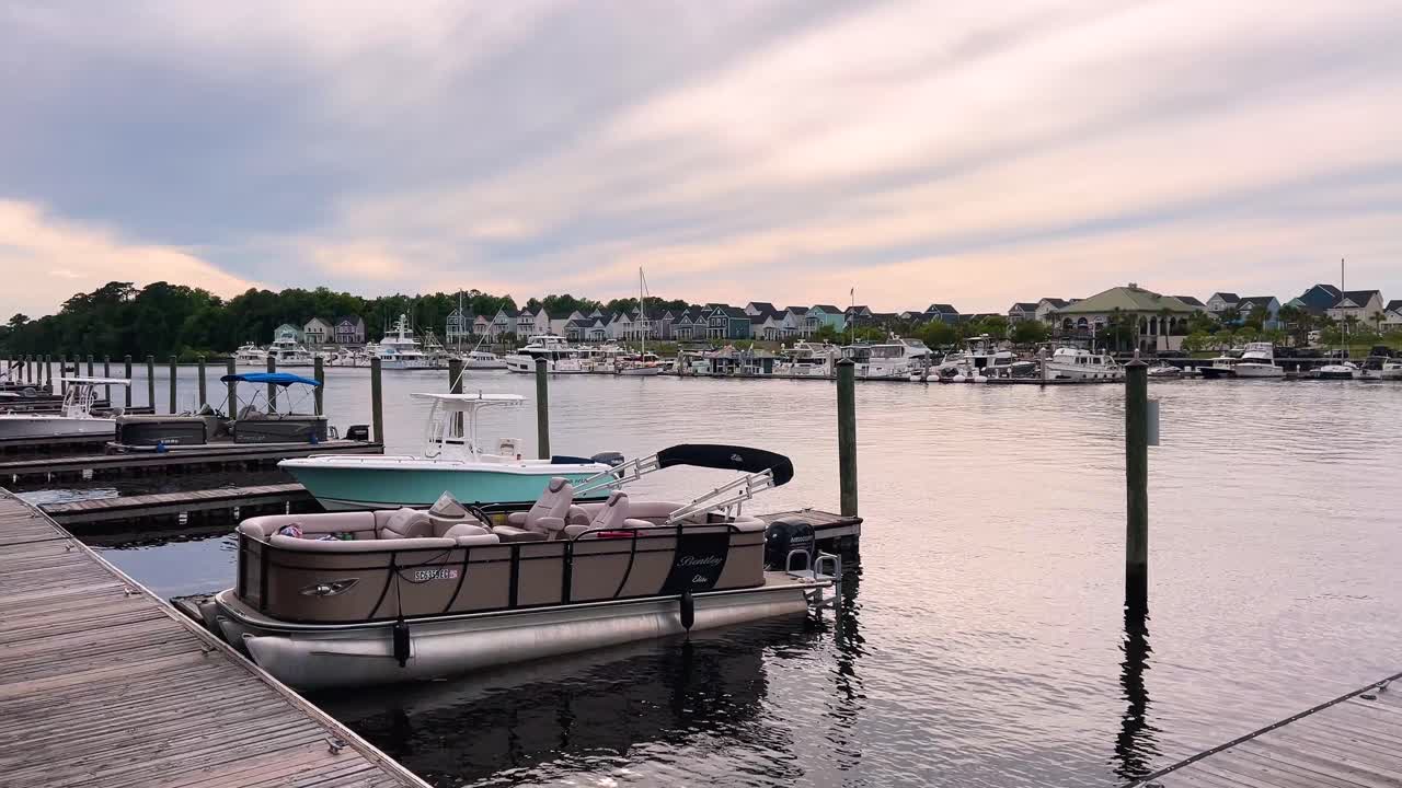 Boats docked on the water at Barefoot Landing in Myrtle Beach South Carolina.