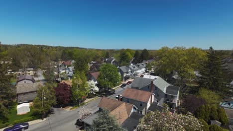 FPV-approaching-shot-of-quiet-street-with-parking-cars-in-american-neighborhood