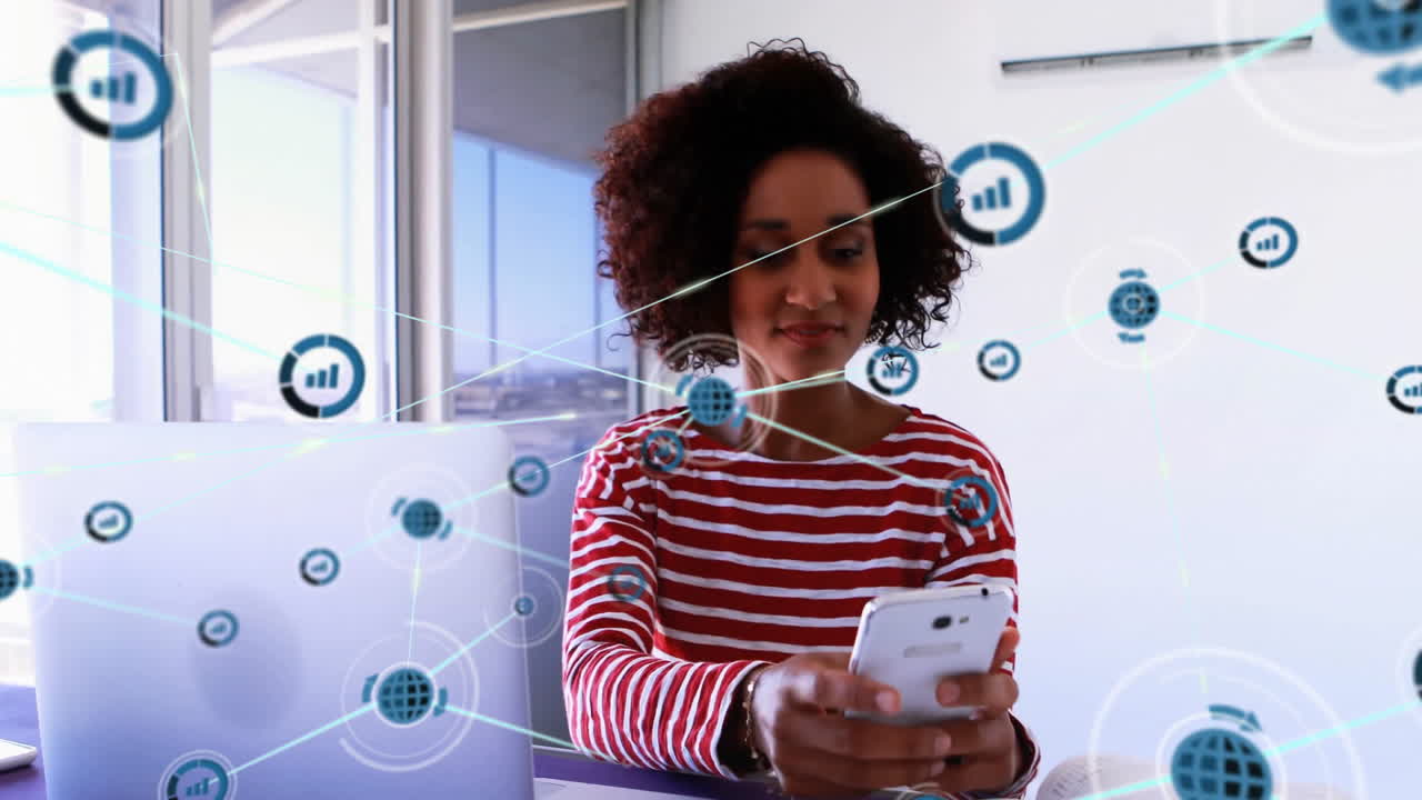 Animation of network of connections with graph icons over african american businesswoman in office