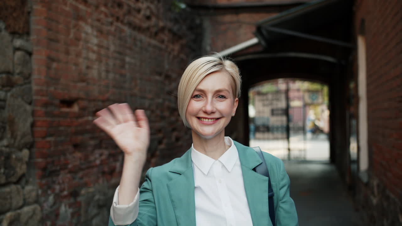 Woman in a Green Blazer in an Urban Setting
