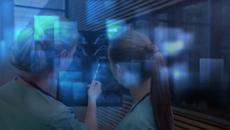 Digital-animation-of-multiple-blue-square-shapes-moving-against-two-female-medical-professional-exam