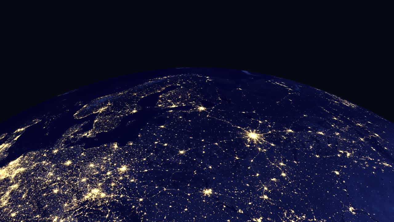 Digital animation zooms from space to illuminated city lights across Northern Europe at night