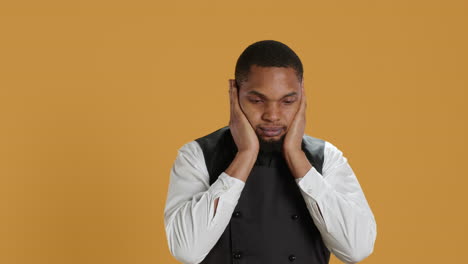 Restaurant-staff-covering-his-eyes,-mouth-and-ears-against-evil-in-studio