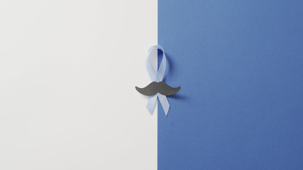 하 ⁇ 색과 파란색 배경에 종이  ⁇ 수염과 연한 파란색 전립선 암 리본의 비디오