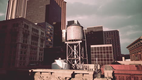 vintage view of a city rooftop with water tower