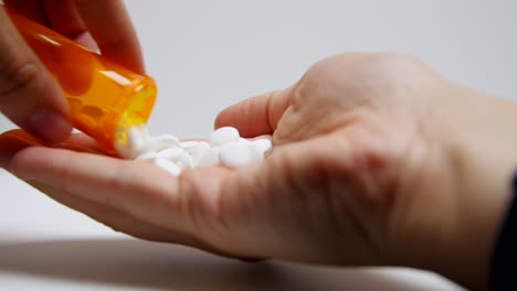 doctor gives patient a handful of pills