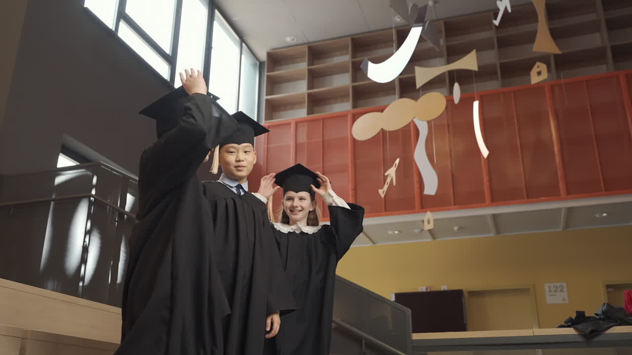 Happy  Students Throwing Their Mortarboards Up In The Air 3