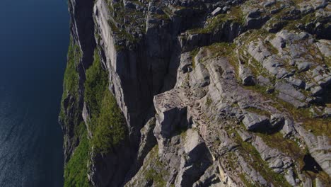 breathtaking aerial view of preikestolen cliff overlooking lysefjord, norway’s dramatic fjord scenery.