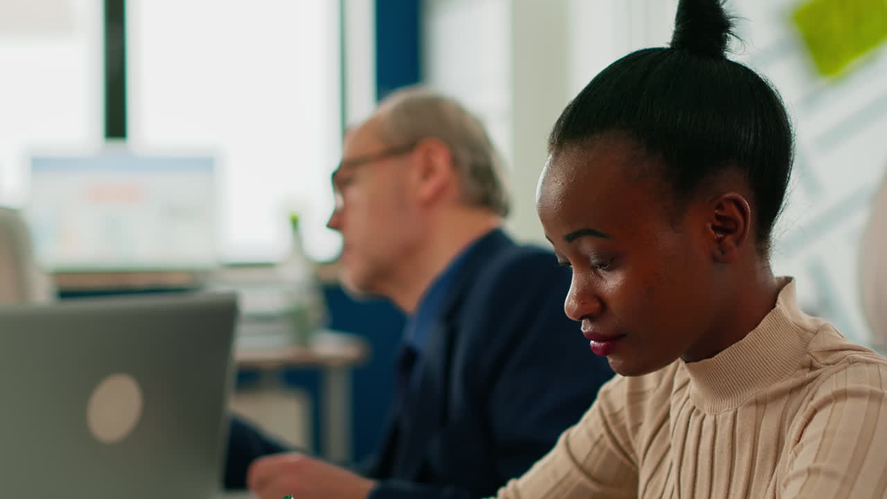 Black manager woman looking at camera smiling