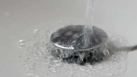 water pouring from a faucet tap slow motion