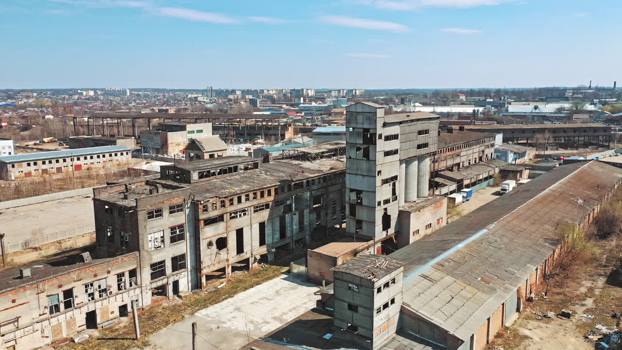 Abandoned building. Aerial view of an old factory ruin and broken windows.
