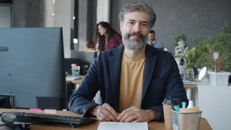 mid-adult man working in office