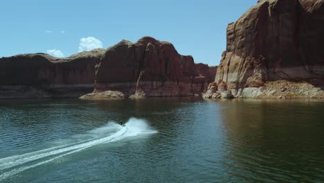 Sea-Splashing-With-Traveling-Jet-Ski-At-Lake-Powell-Canyons-In-Utah,-Arizona-USA