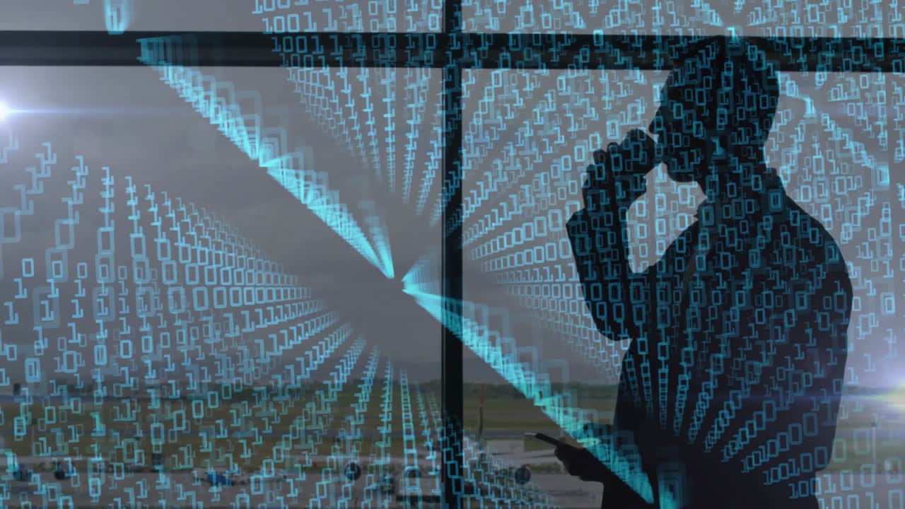 Businessman holding smartphone and tablet by airport window, streaming binary code visualization