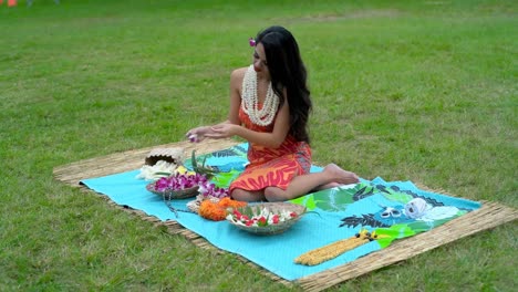 young woman preparing garland in the garden 4k