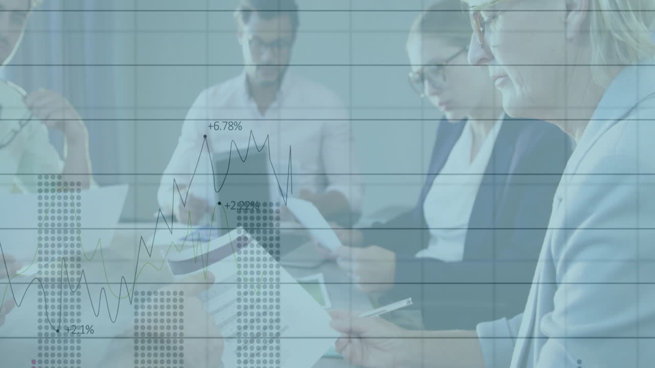 Three professionals writing, reading and examining tablet in meeting, with financial graph overlays