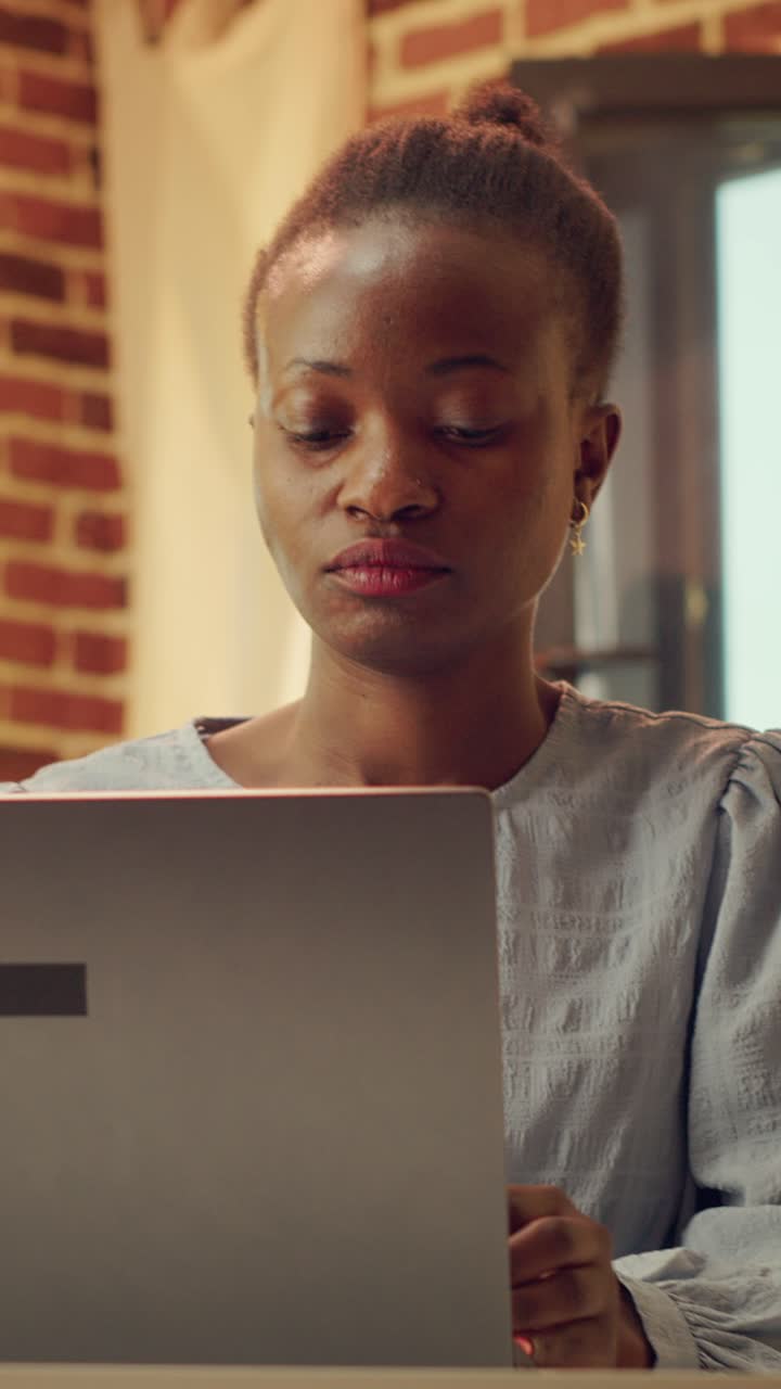 Vertical Portrait of teleworker in warm lit room