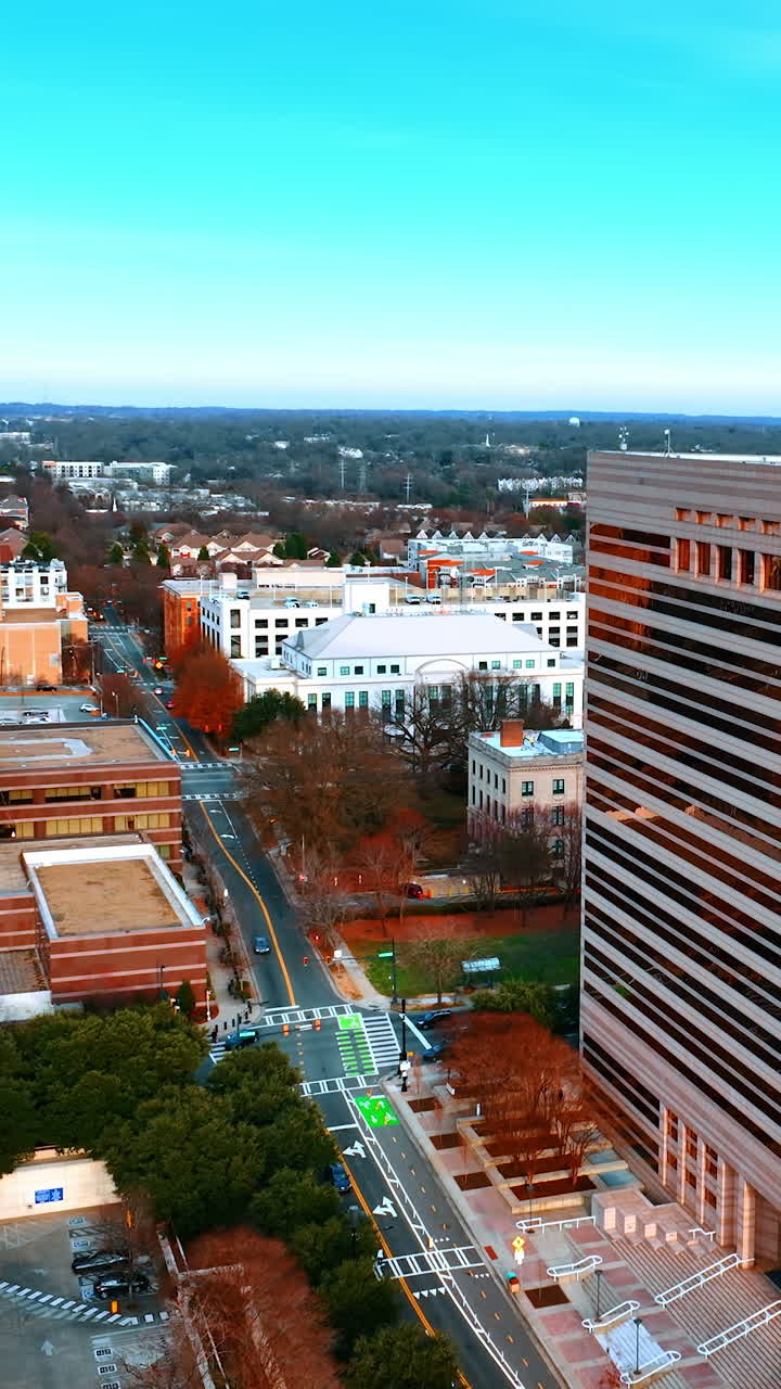 Unusual geometrical architecture of the city Charlotte, North Carolina, USA. Top view on the urban landscape at daytime. Vertical video
