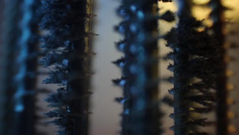 close-up-of-metal-screws-with-metal-chips-poured-on