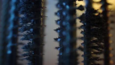 close up of metal screws with metal chips poured on