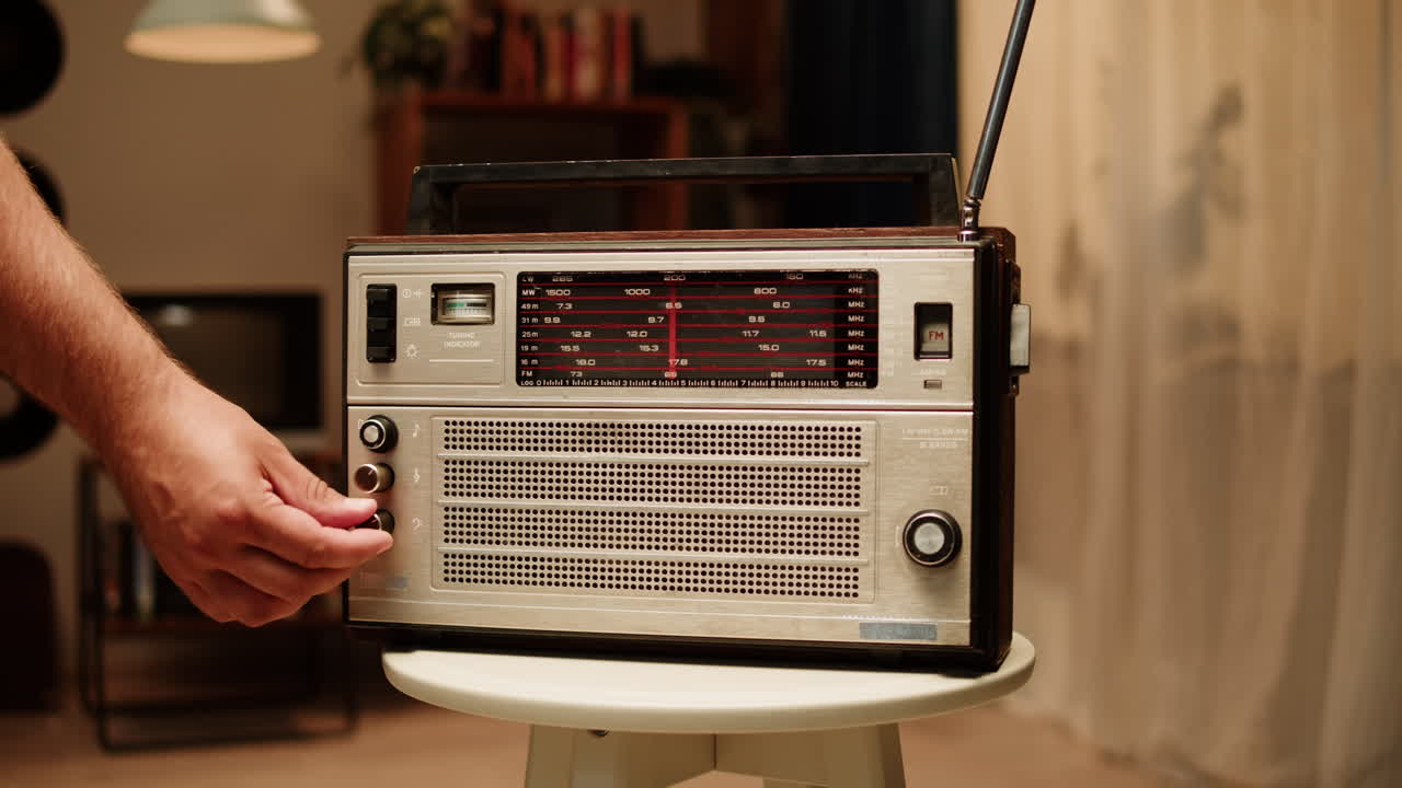 Man tuning a vintage radio