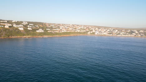 Long shot aerial over ocean shows Vleesbaai popular holiday destination