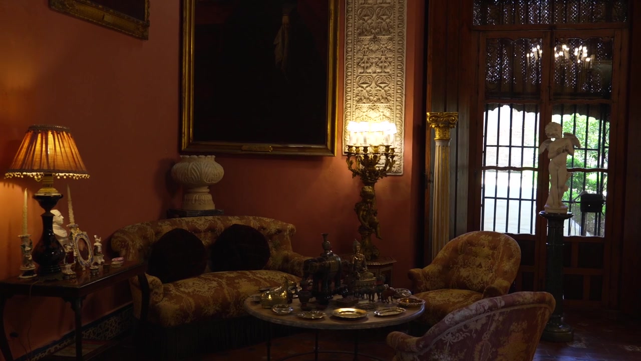 Historic Seville Interior with Antique Furniture and Warm Lighting