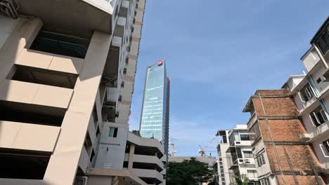 a gradual upward pan from street to skyscraper.