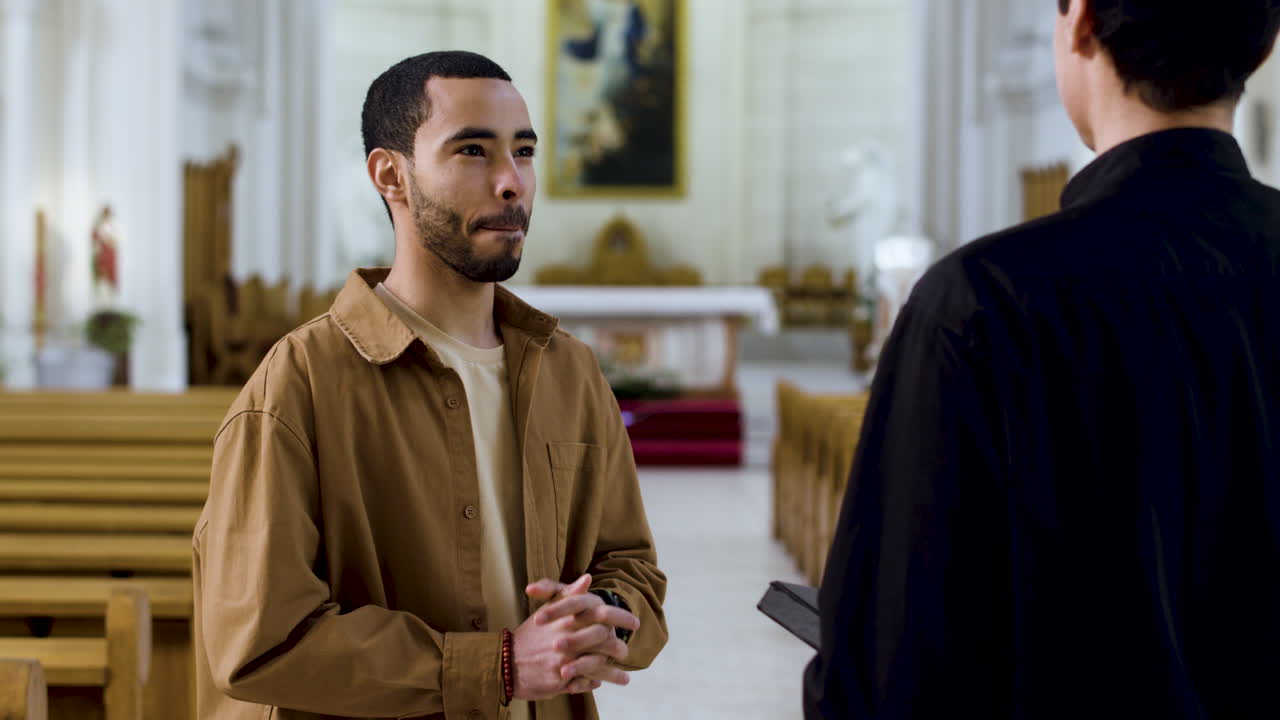 Two men talking indoors