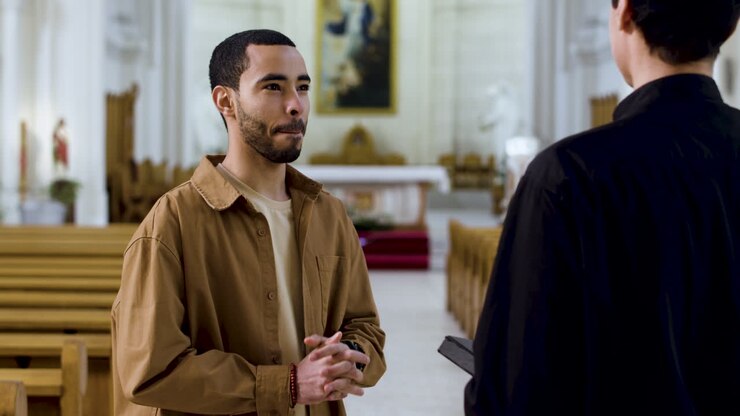 Two men talking indoors