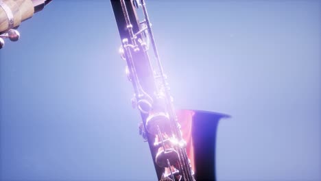 golden tenor saxophone on blue background with light