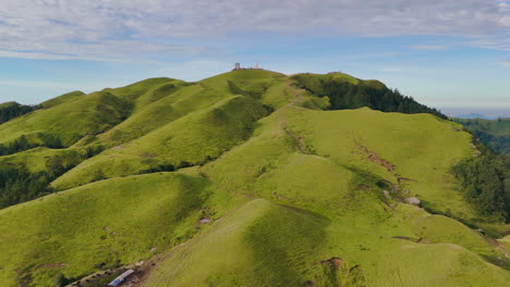 drone shot captures lush greenery of nepal under a clear blue sky on a sunny day landscape features trekking trails and peaceful escape into nature surrounded by forests serene beauty dolakha shailung