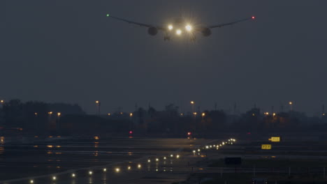 airplane landing at night in fog