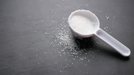 sugar in a measuring spoon