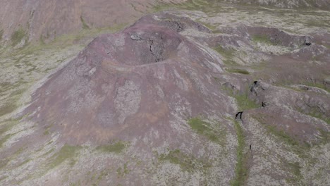 Bowl-shaped-volcano-besides-Geitafell-slopes-in-wild-Iceland,-aerial