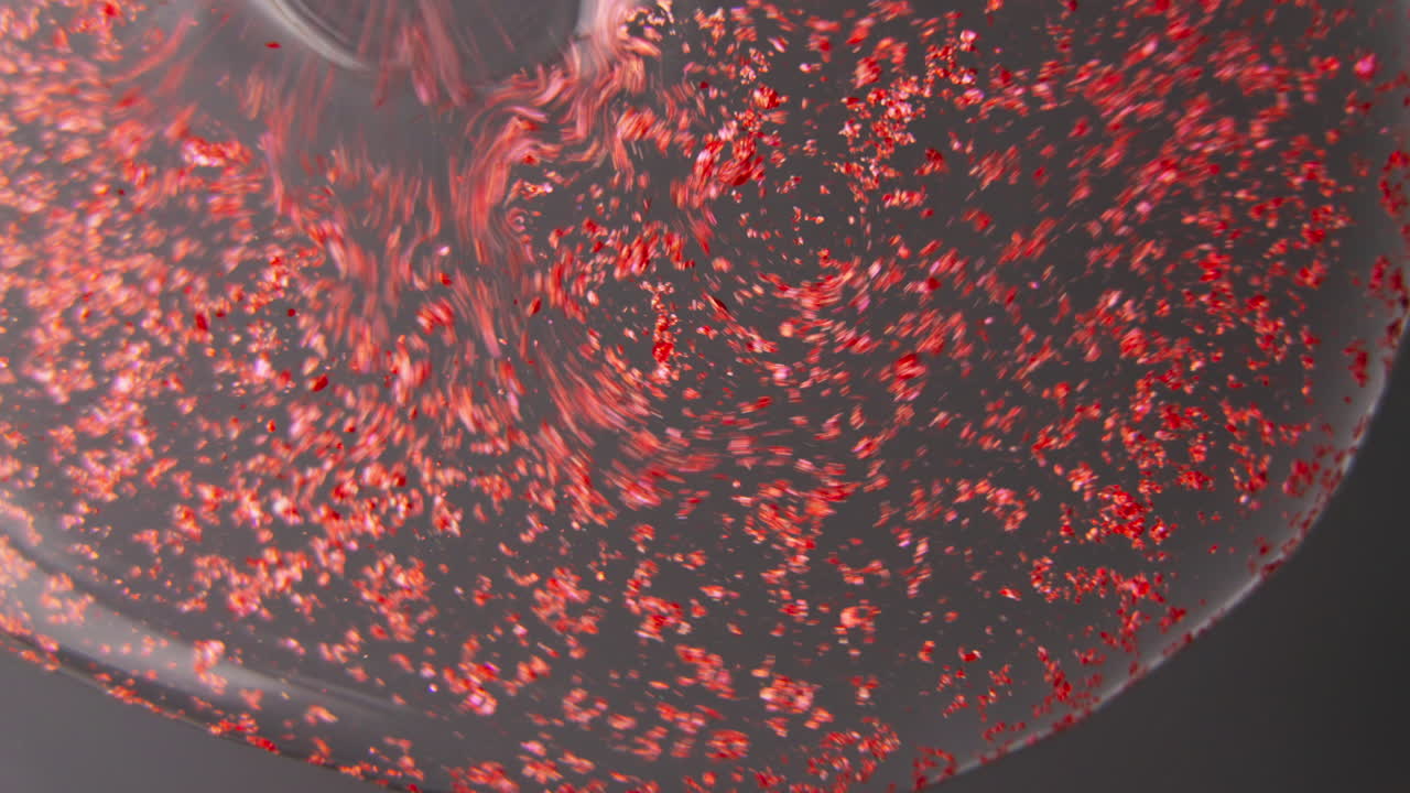 Abstract Red Particles in Liquid